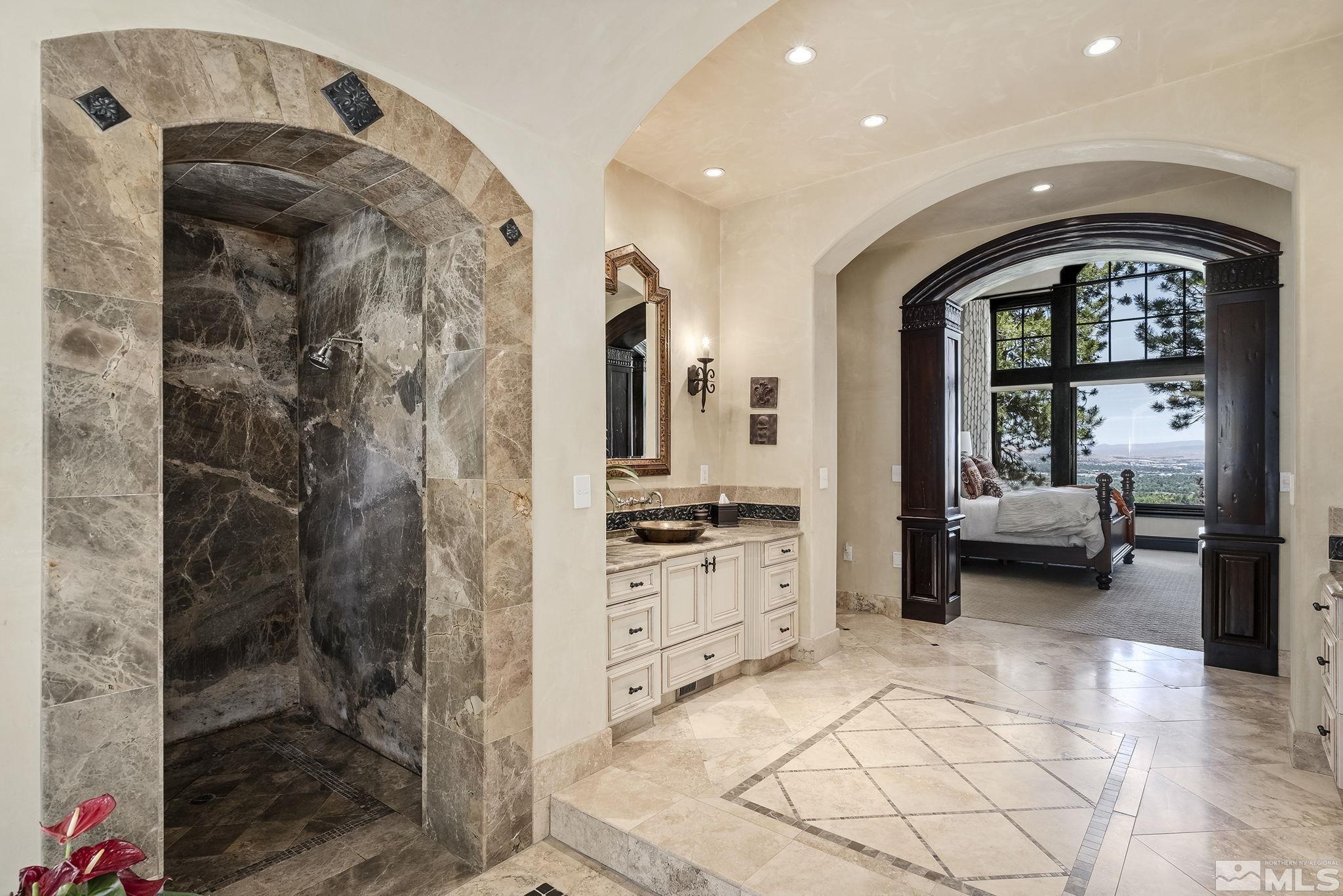 90 Hawken Road Reno, NV 89519 - Photo 22 of 40 a en suite bathroom with a granite countertop sink and a mirror