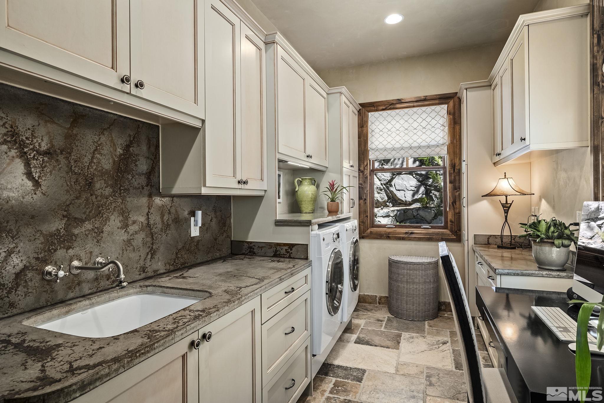 90 Hawken Road Reno, NV 89519 - Photo 29 of 40 a kitchen with stainless steel appliances granite countertop a sink stove and cabinets