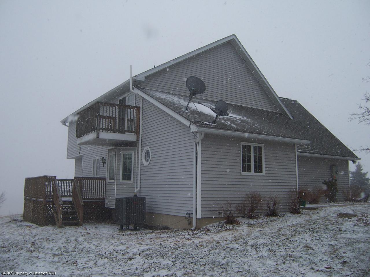 1915 Newton Ransom Boulevard Clarks Summit, PA 18411 - Photo 7 of 8 a front view of a house with garden
