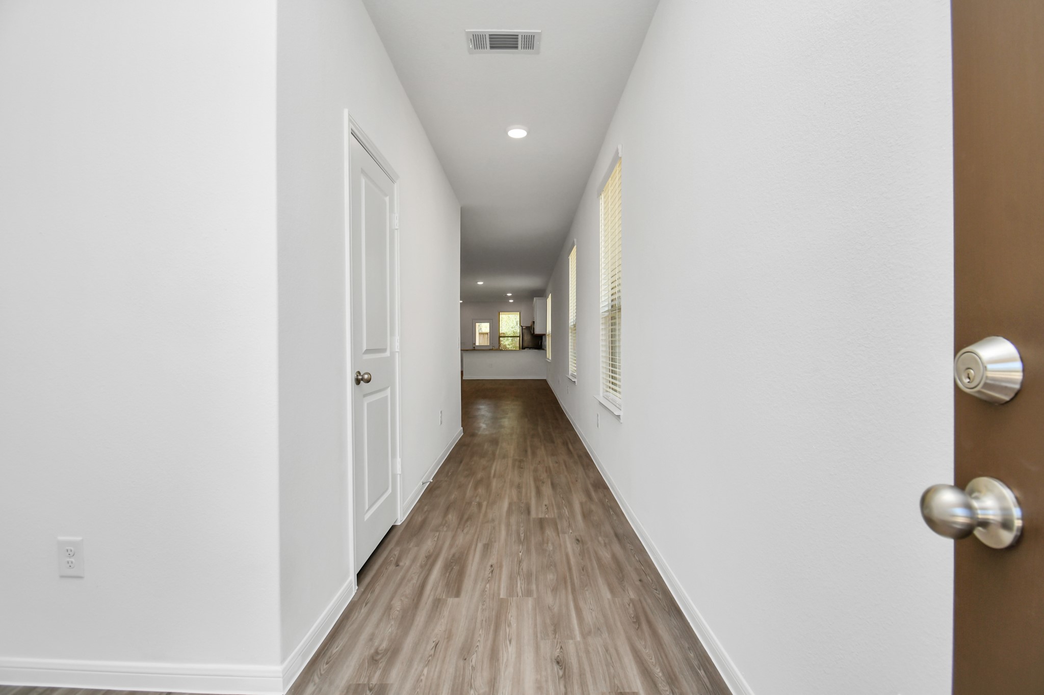 16150 Elbridge Court Conroe, TX 77302 - Photo 4 of 46 Stepping through the front door, the interior reveals itself with a sense of spaciousness and sophistication.