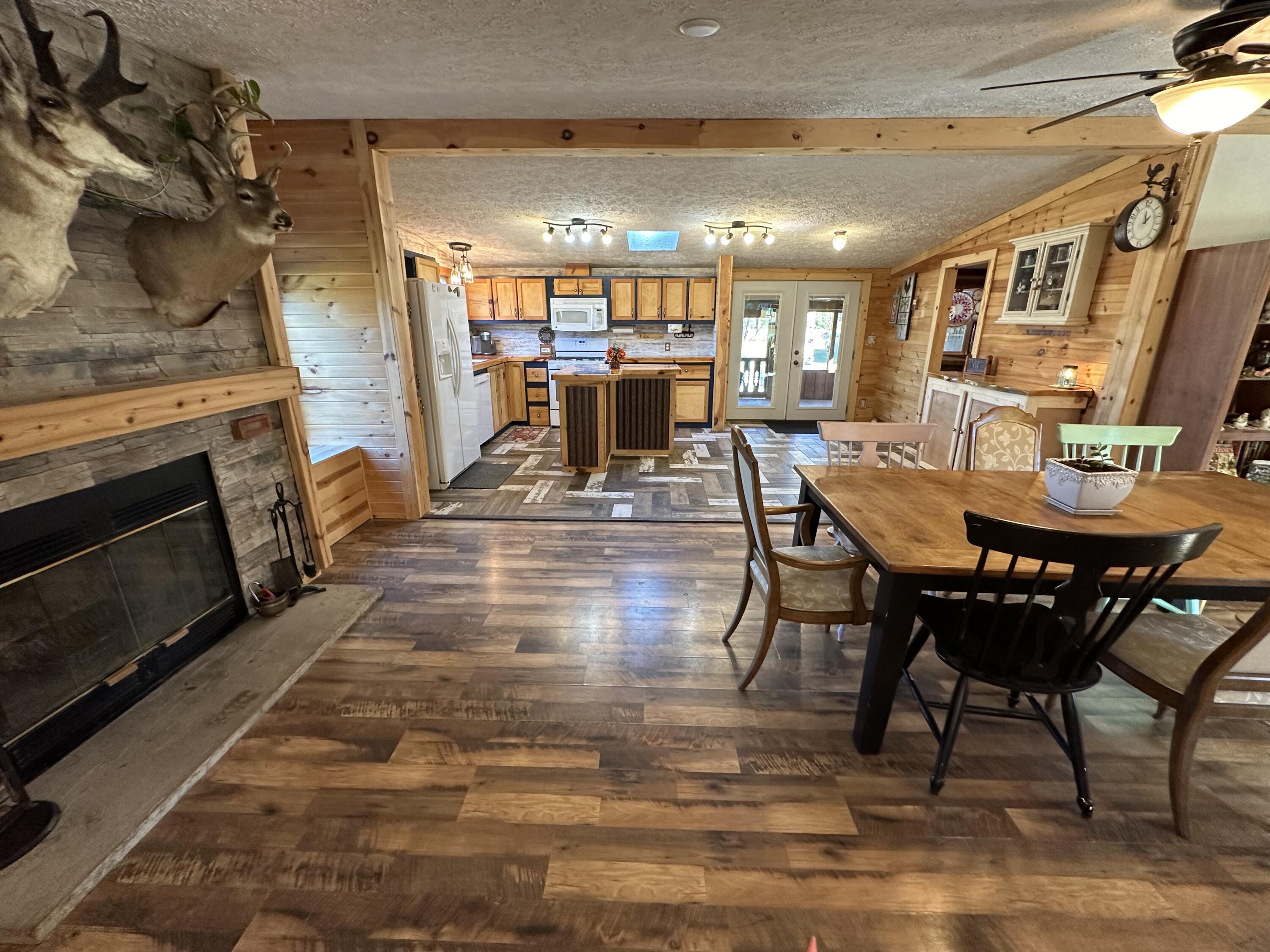10225 Summit City Road Kingsley, MI 49649 - Photo 15 of 60 Dining with wood burning fp