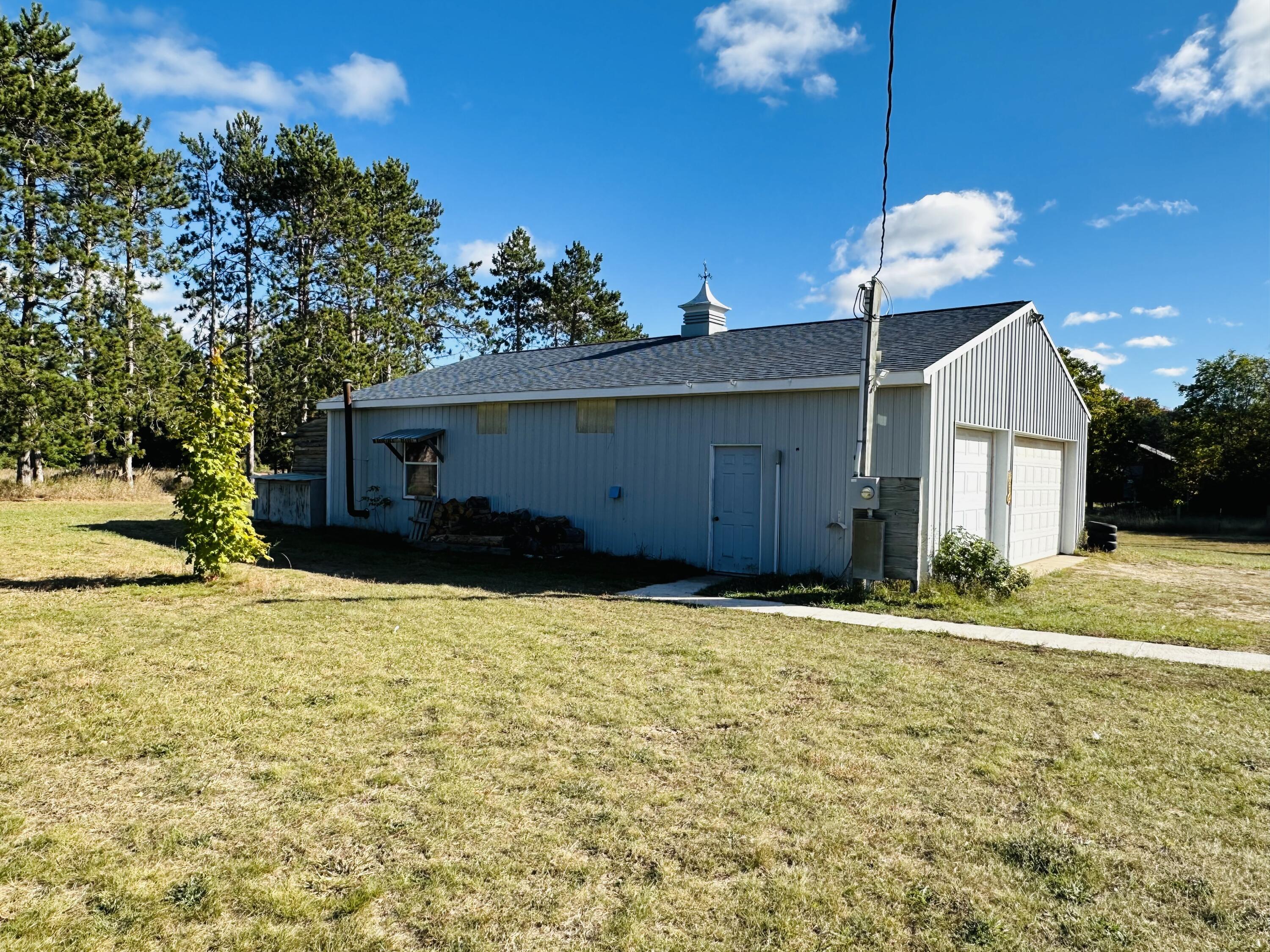 10225 Summit City Road Kingsley, MI 49649 - Photo 41 of 60 Pole barn with large workshop area