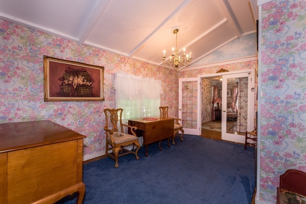 1371 Broadway Hanover, MA 02339 - Photo 12 of 24 a living room with furniture and a chandelier