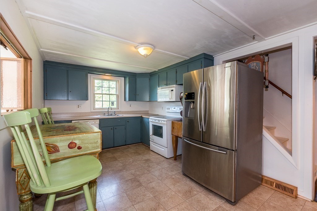 1371 Broadway Hanover, MA 02339 - Photo 15 of 24 a kitchen with a refrigerator a sink dishwasher and a refrigerator