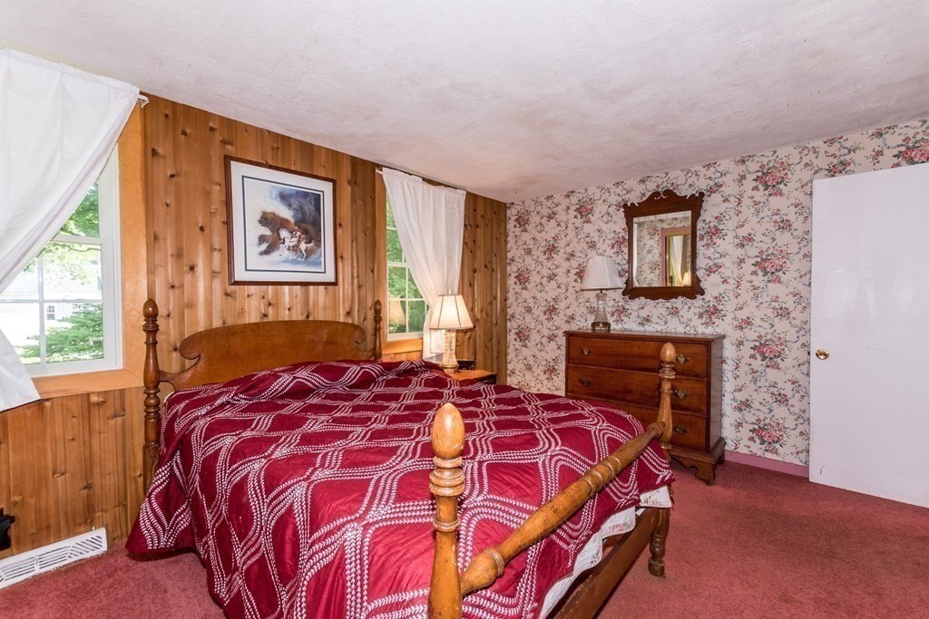 1371 Broadway Hanover, MA 02339 - Photo 18 of 24 a bedroom with a bed and a fireplace