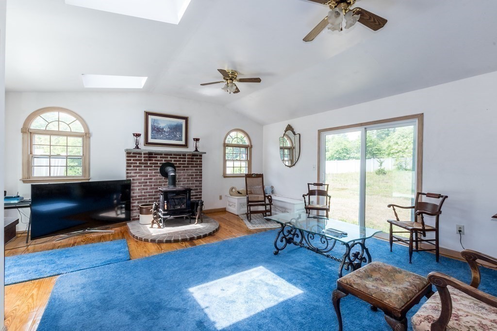 1371 Broadway Hanover, MA 02339 - Photo 19 of 24 a living room with furniture fireplace and window