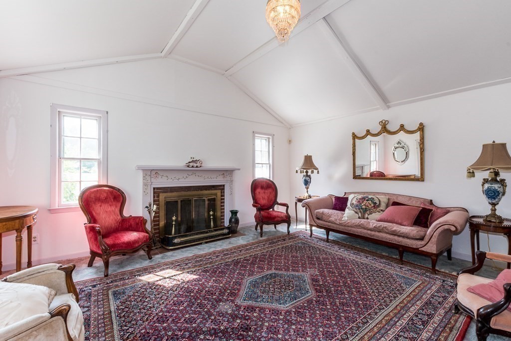 1371 Broadway Hanover, MA 02339 - Photo 2 of 24 a living room with furniture and a fireplace