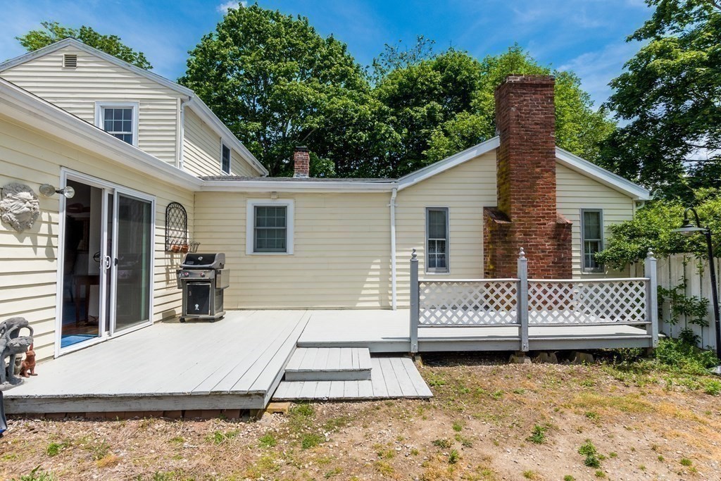 1371 Broadway Hanover, MA 02339 - Photo 7 of 24 a view of a house with a yard and sitting area