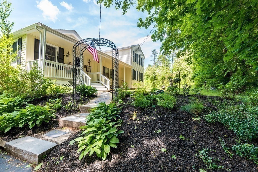1371 Broadway Hanover, MA 02339 - Photo 9 of 24 a front view of a house with a yard