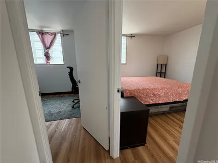 a view of bathroom with a sink and mirror