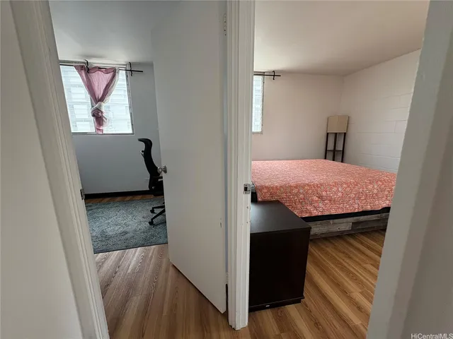 a view of bathroom with a sink and mirror