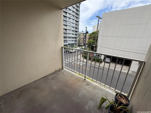 a view of balcony with wooden floor