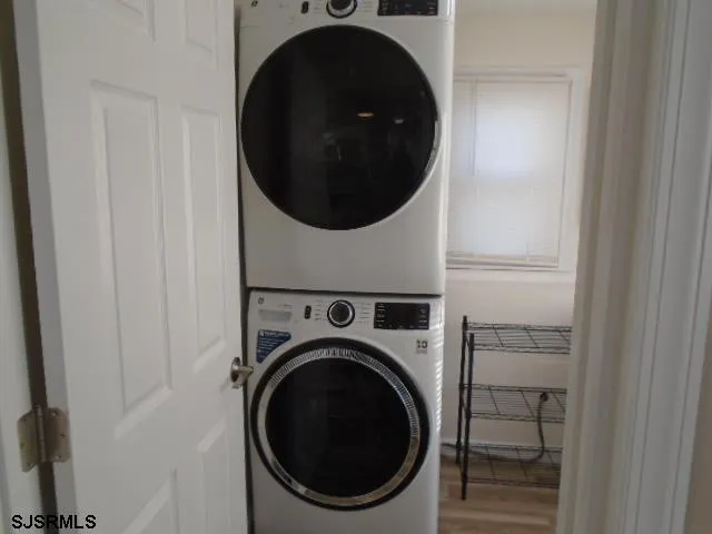 a close view of a utility room with dryer and washer