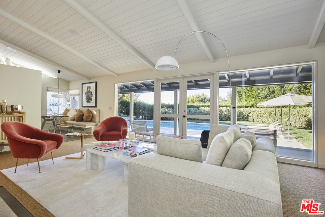 9428 Lloydcrest Drive Beverly Hills, CA 90210 - Photo 2 of 36 a living room with furniture and a large window