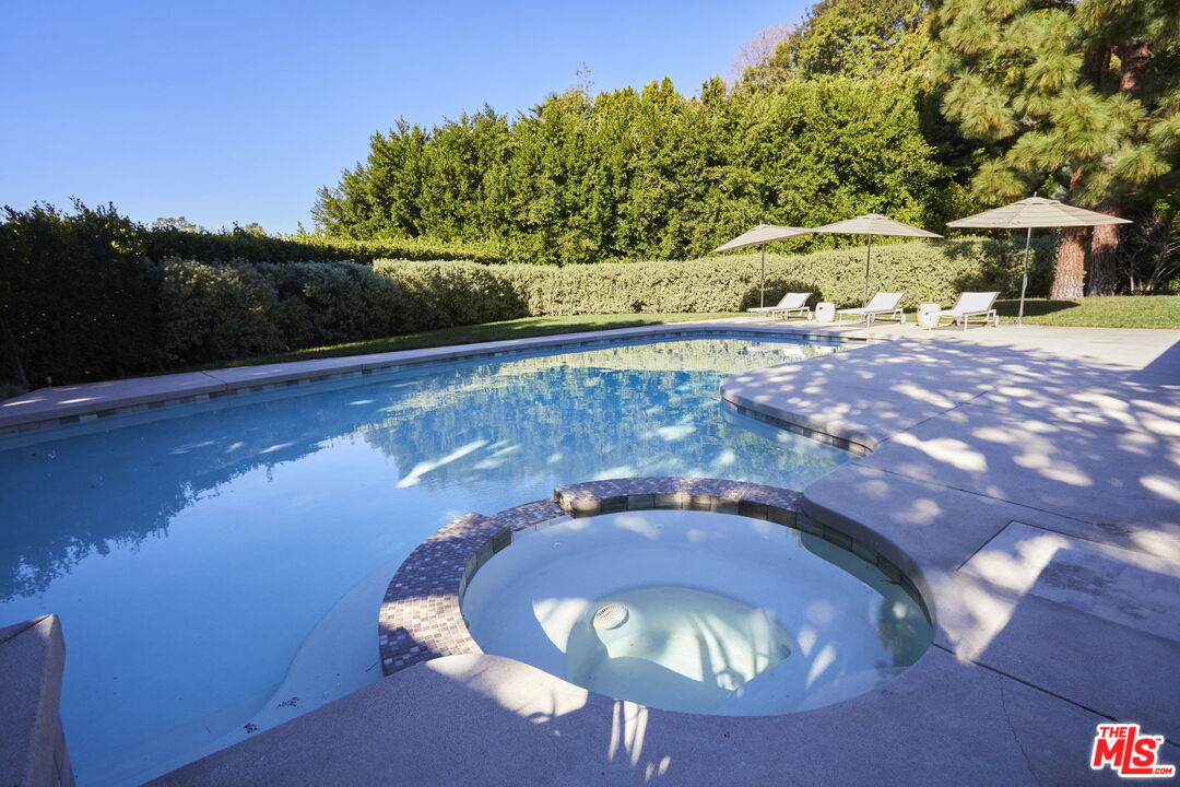 9428 Lloydcrest Drive Beverly Hills, CA 90210 - Photo 16 of 36 a view of swimming pool in a yard