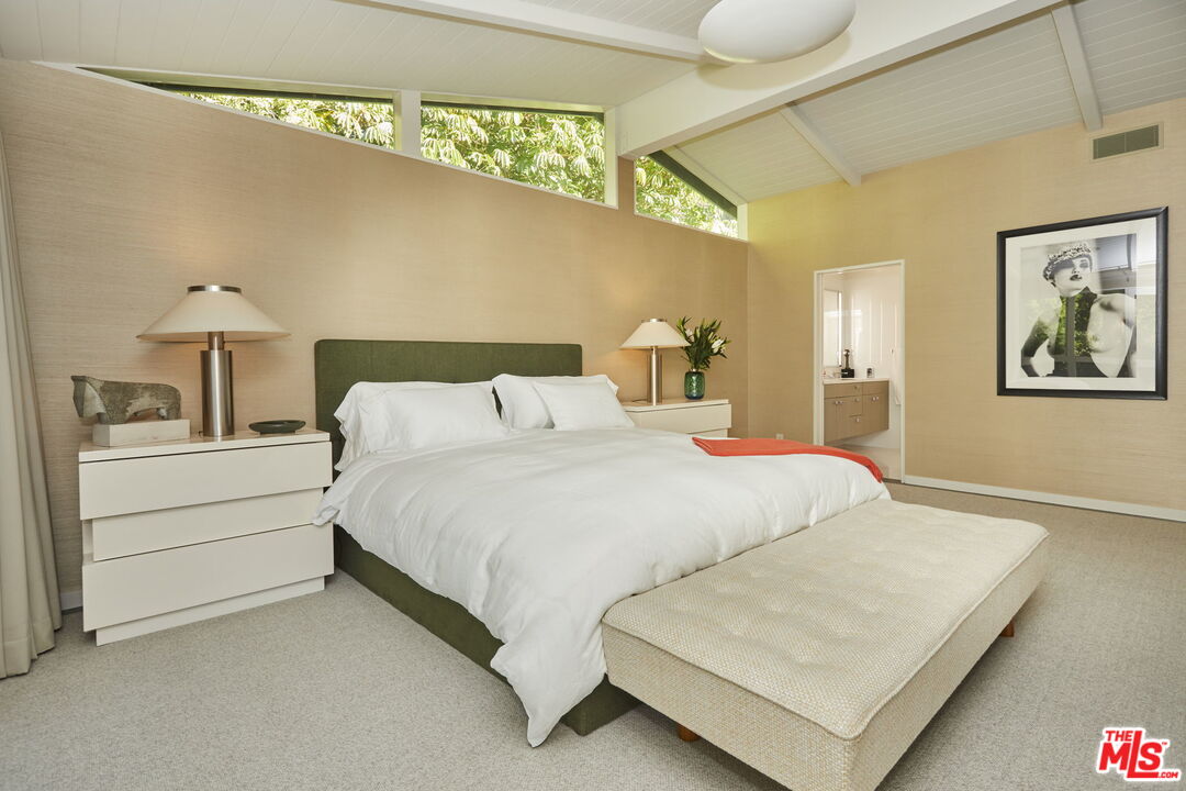 9428 Lloydcrest Drive Beverly Hills, CA 90210 - Photo 25 of 36 a bed room with a bed and a night stand