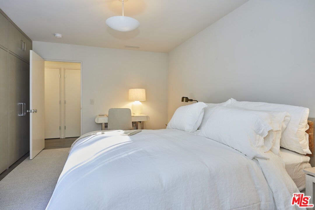 9428 Lloydcrest Drive Beverly Hills, CA 90210 - Photo 27 of 36 a large white bed in a white room