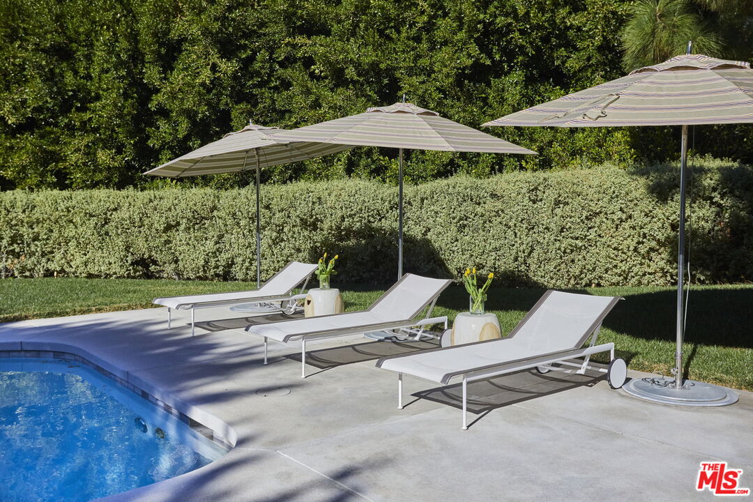 9428 Lloydcrest Drive Beverly Hills, CA 90210 - Photo 31 of 36 a view of backyard with outdoor seating and yard