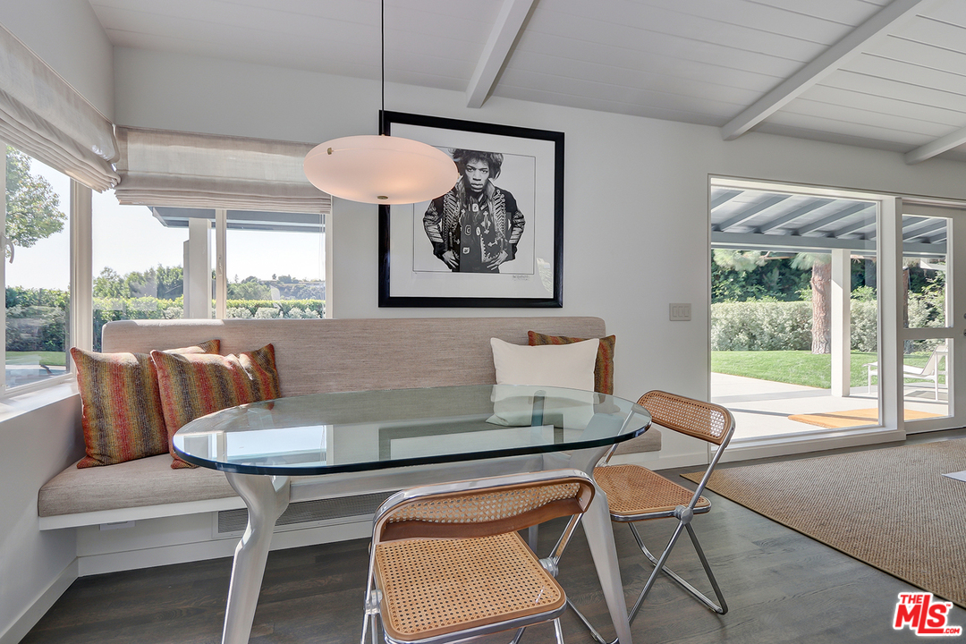 9428 Lloydcrest Drive Beverly Hills, CA 90210 - Photo 8 of 36 a view of a dining room with furniture window and outside view