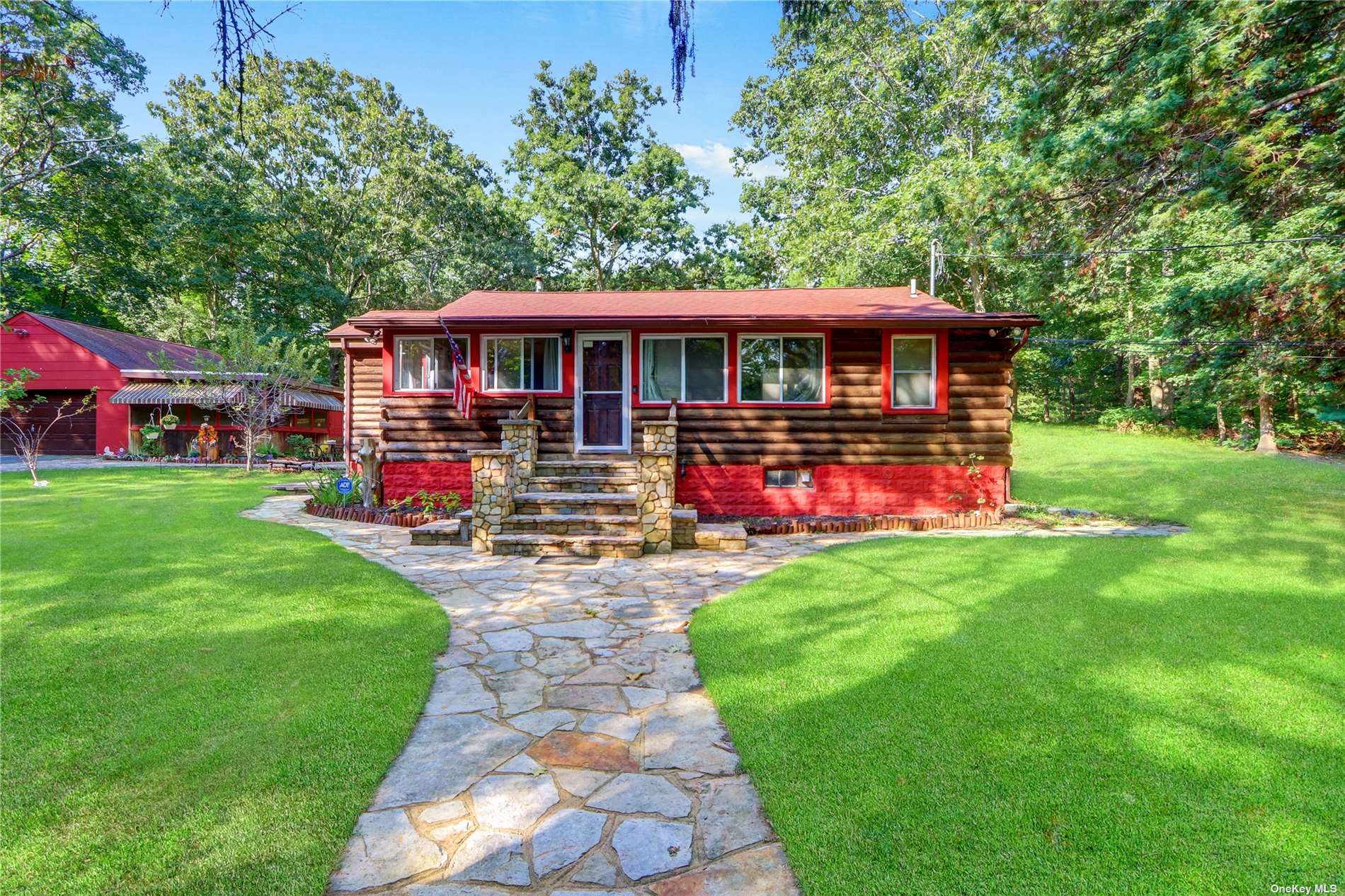 26 Medford Road Ridge, NY 11961 - Photo 1 of 1 a front view of a house with garden