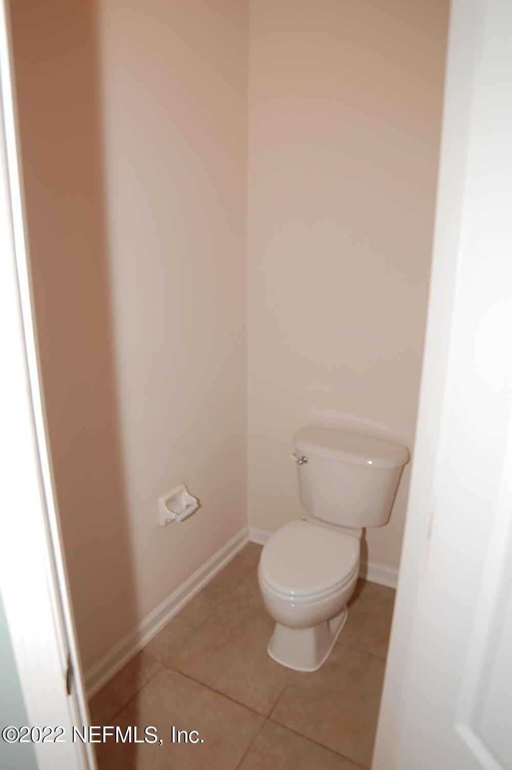 562 Candlebark Drive Jacksonville, FL 32225 - Photo 15 of 30 a white toilet sitting next to a shower
