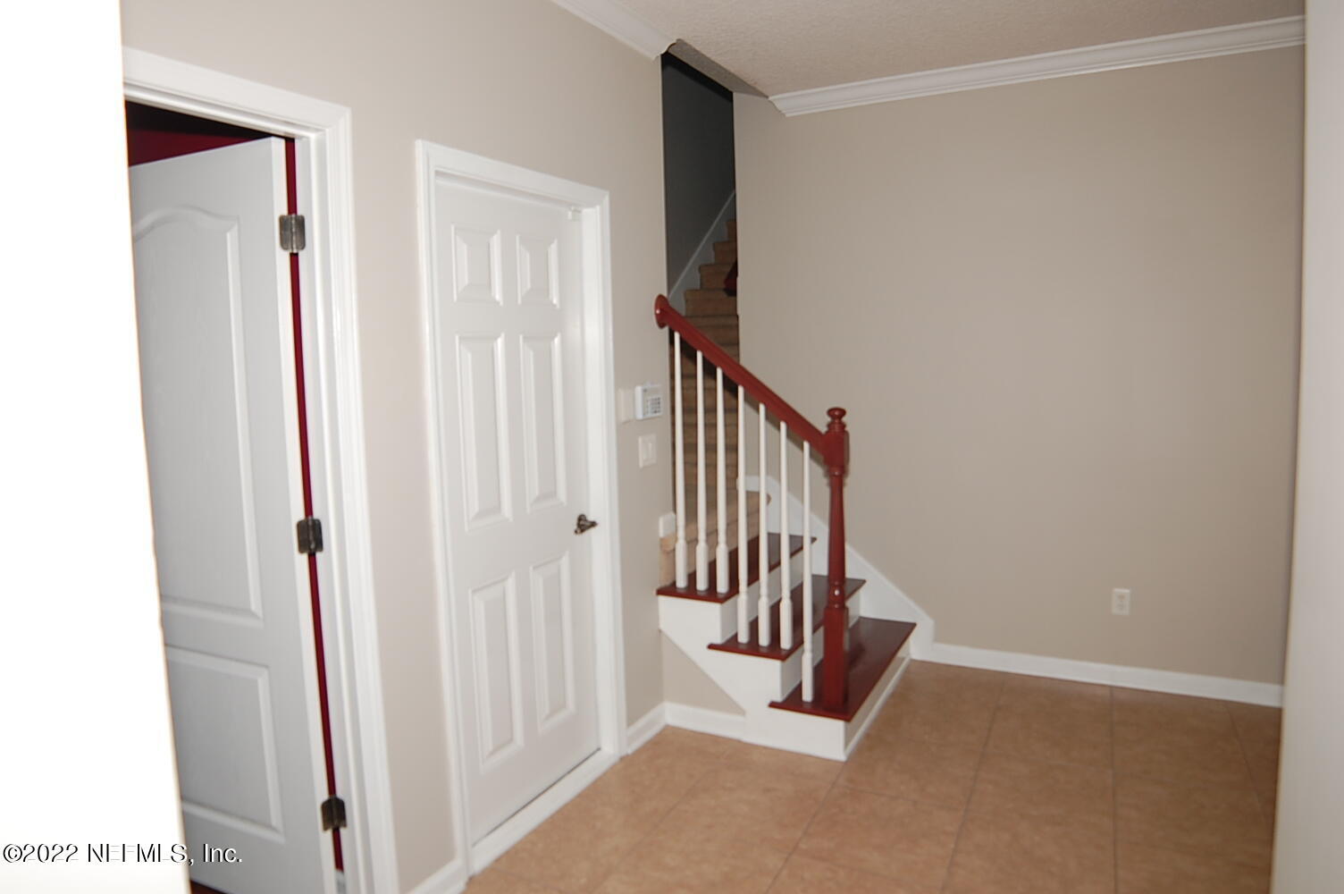 562 Candlebark Drive Jacksonville, FL 32225 - Photo 16 of 30 a view of a hallway with staircase