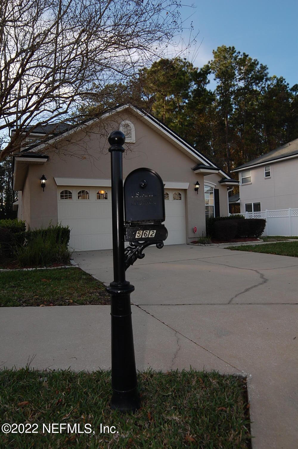 562 Candlebark Drive Jacksonville, FL 32225 - Photo 2 of 30 a front view of a house with garden