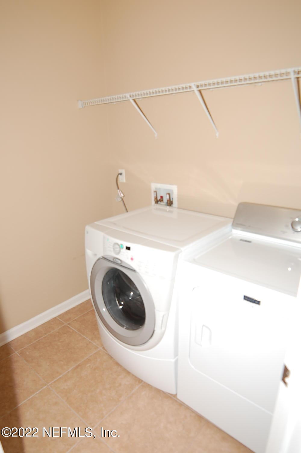 562 Candlebark Drive Jacksonville, FL 32225 - Photo 22 of 30 a utility room with dryer and washer