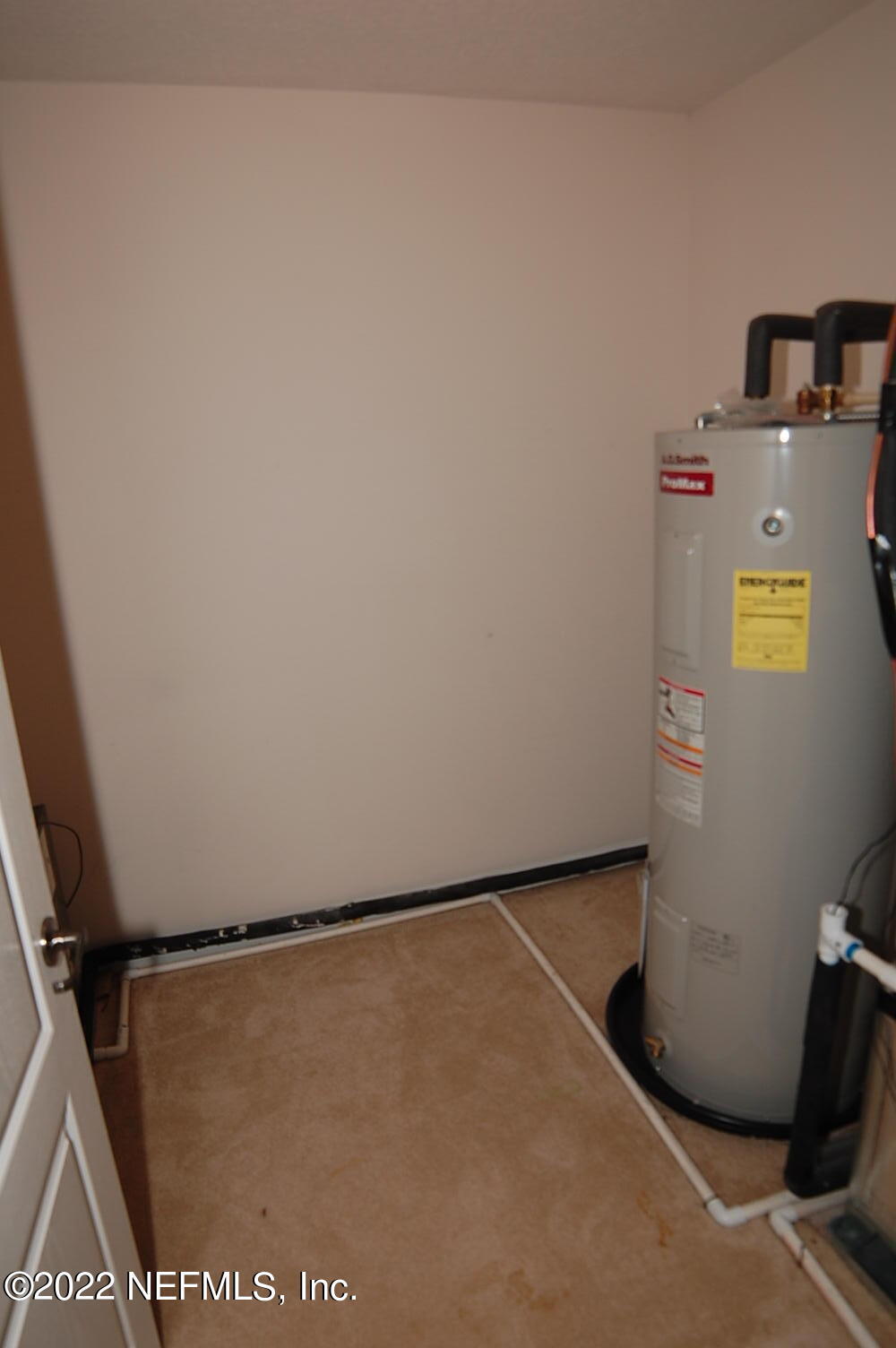 562 Candlebark Drive Jacksonville, FL 32225 - Photo 27 of 30 a view of walk in closet with empty racks