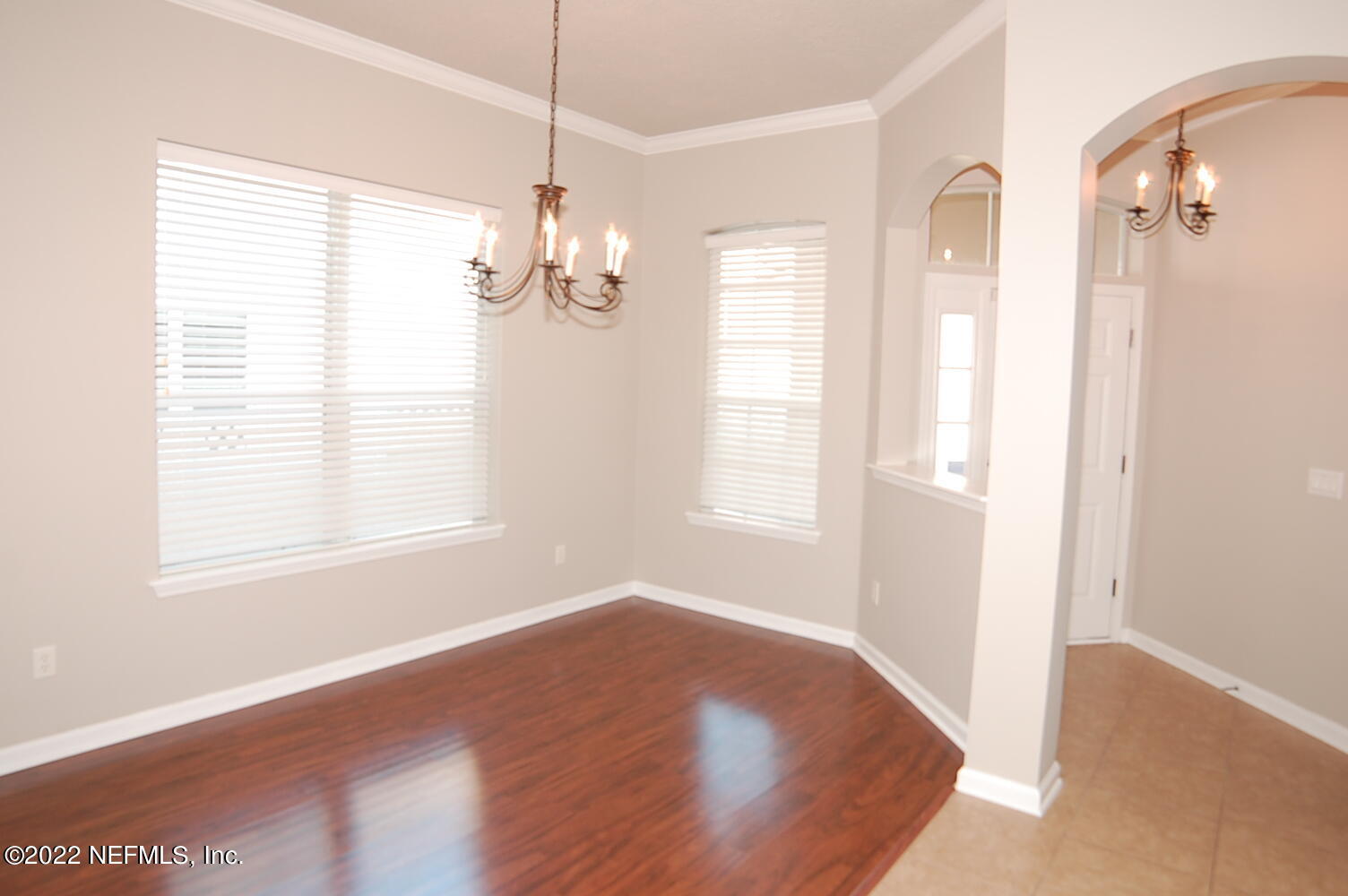562 Candlebark Drive Jacksonville, FL 32225 - Photo 5 of 30 a view of an empty room with wooden floor and a window