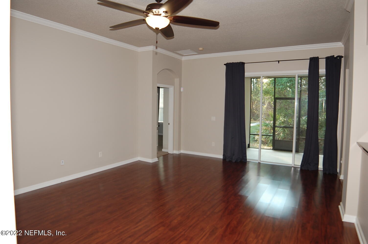 562 Candlebark Drive Jacksonville, FL 32225 - Photo 6 of 30 a view of an empty room with wooden floor and a window