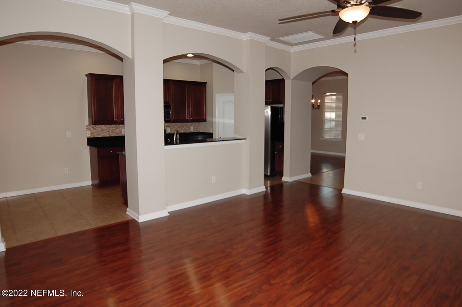 562 Candlebark Drive Jacksonville, FL 32225 - Photo 7 of 30 wooden floor in an empty room with a window