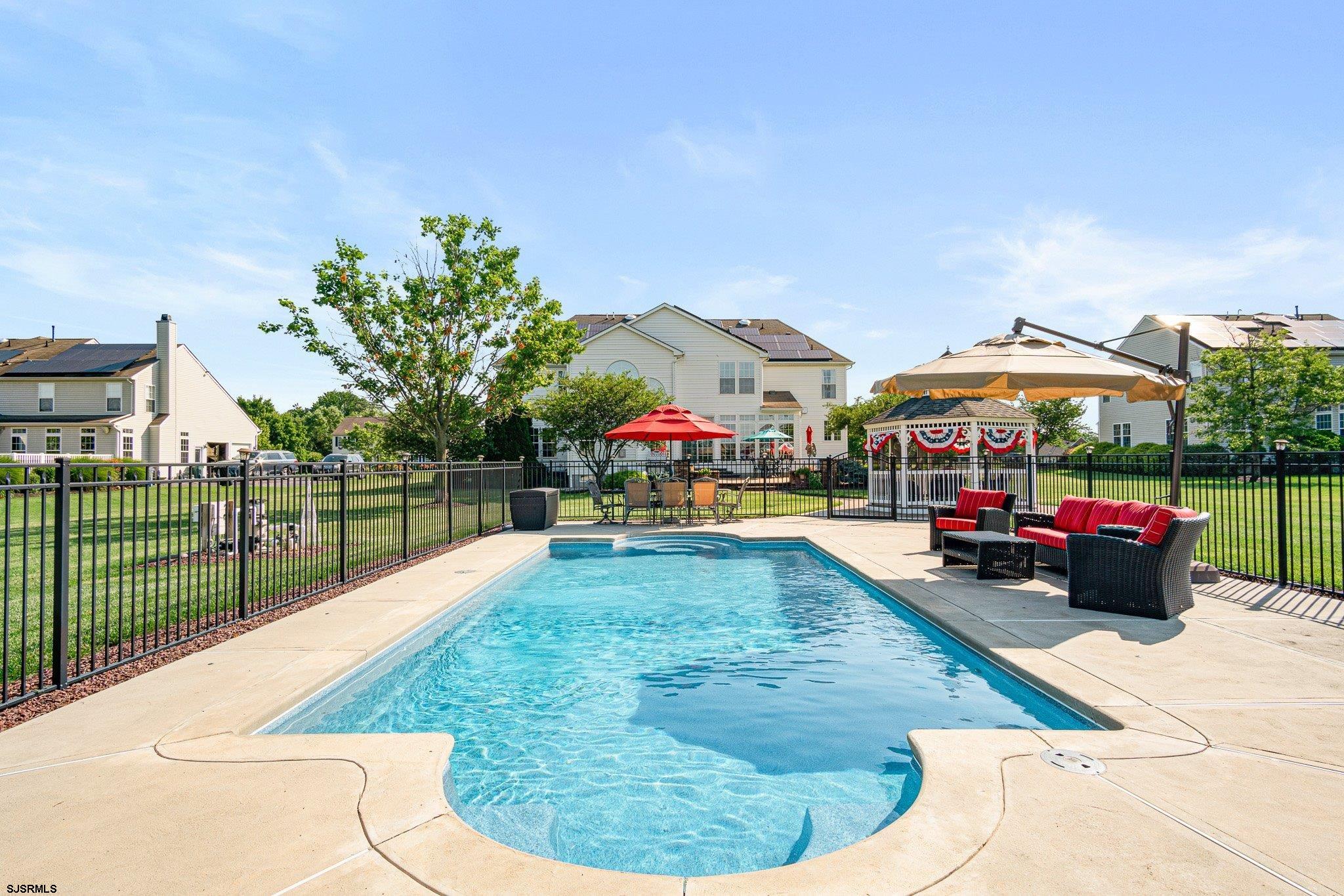 109 Quail Ridge Way Mickleton, NJ 08056 - Photo 11 of 59 a view of a swimming pool with a lounge chairs