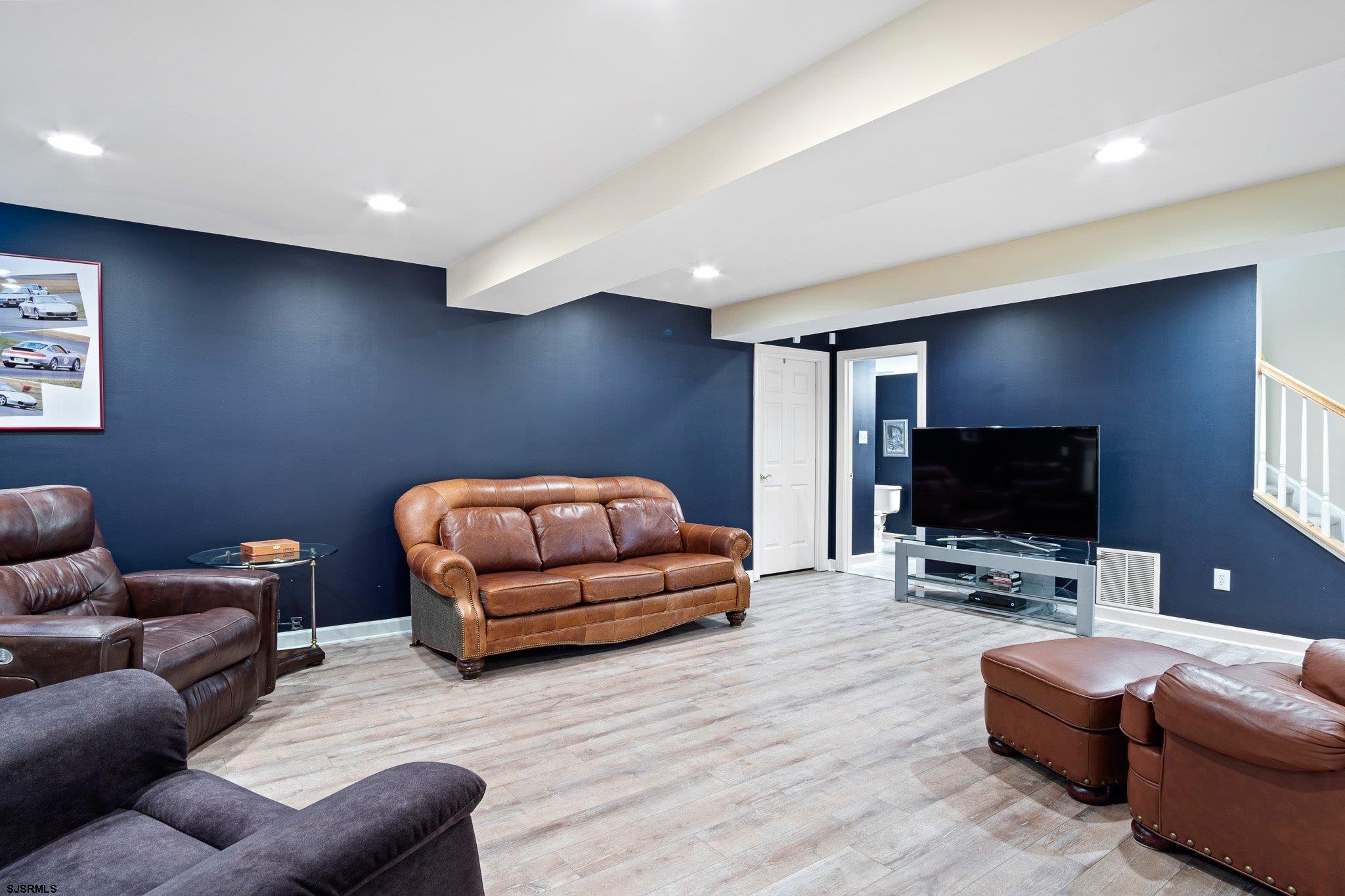 109 Quail Ridge Way Mickleton, NJ 08056 - Photo 23 of 59 a living room with furniture and a flat screen tv