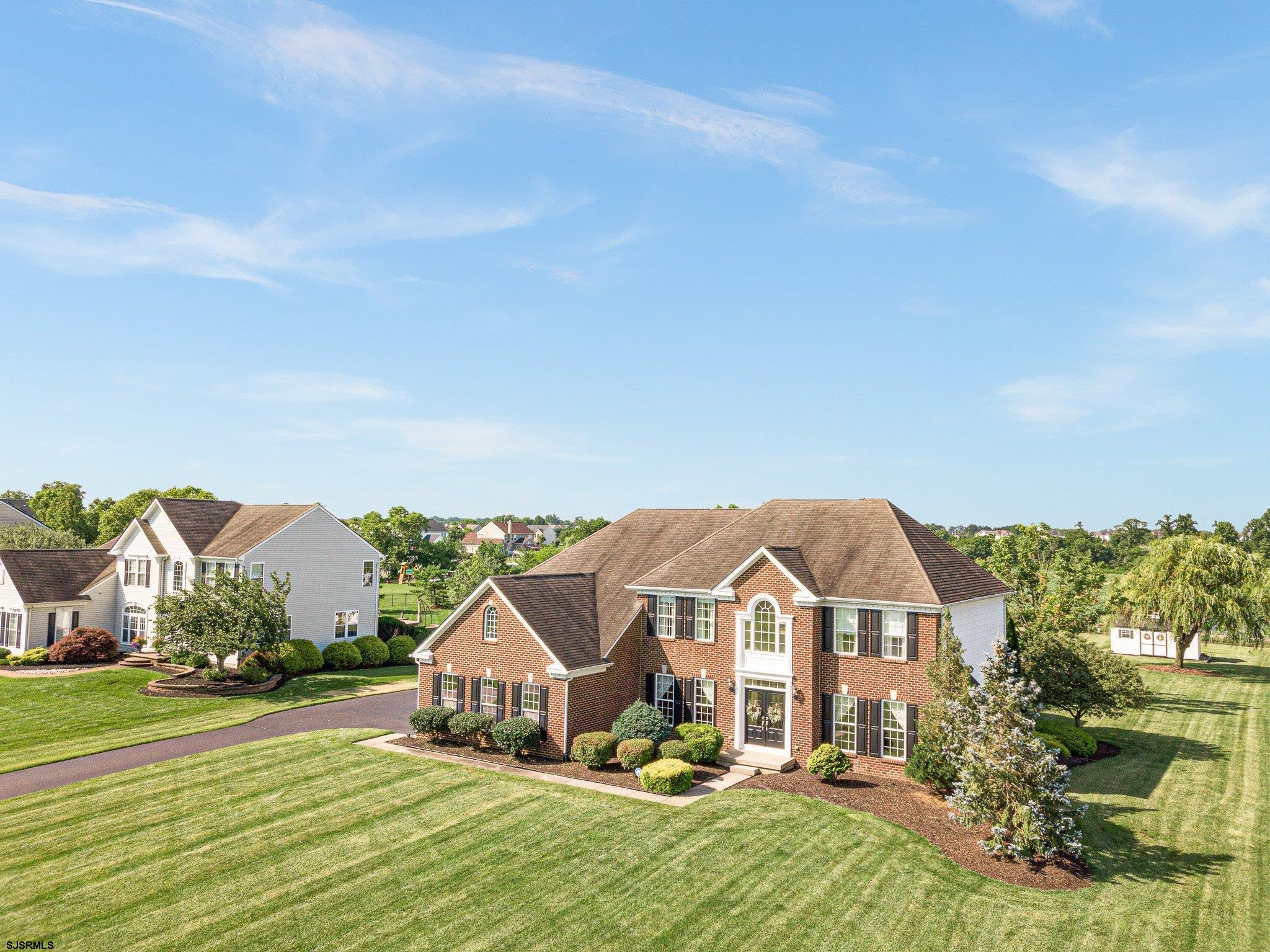 109 Quail Ridge Way Mickleton, NJ 08056 - Photo 3 of 59 a view of a big house with a big yard and large trees