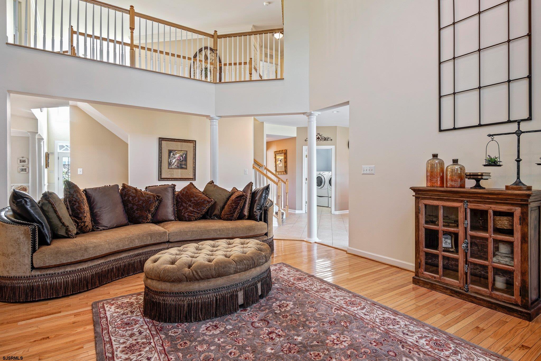 109 Quail Ridge Way Mickleton, NJ 08056 - Photo 32 of 59 a living room with furniture a rug and a window