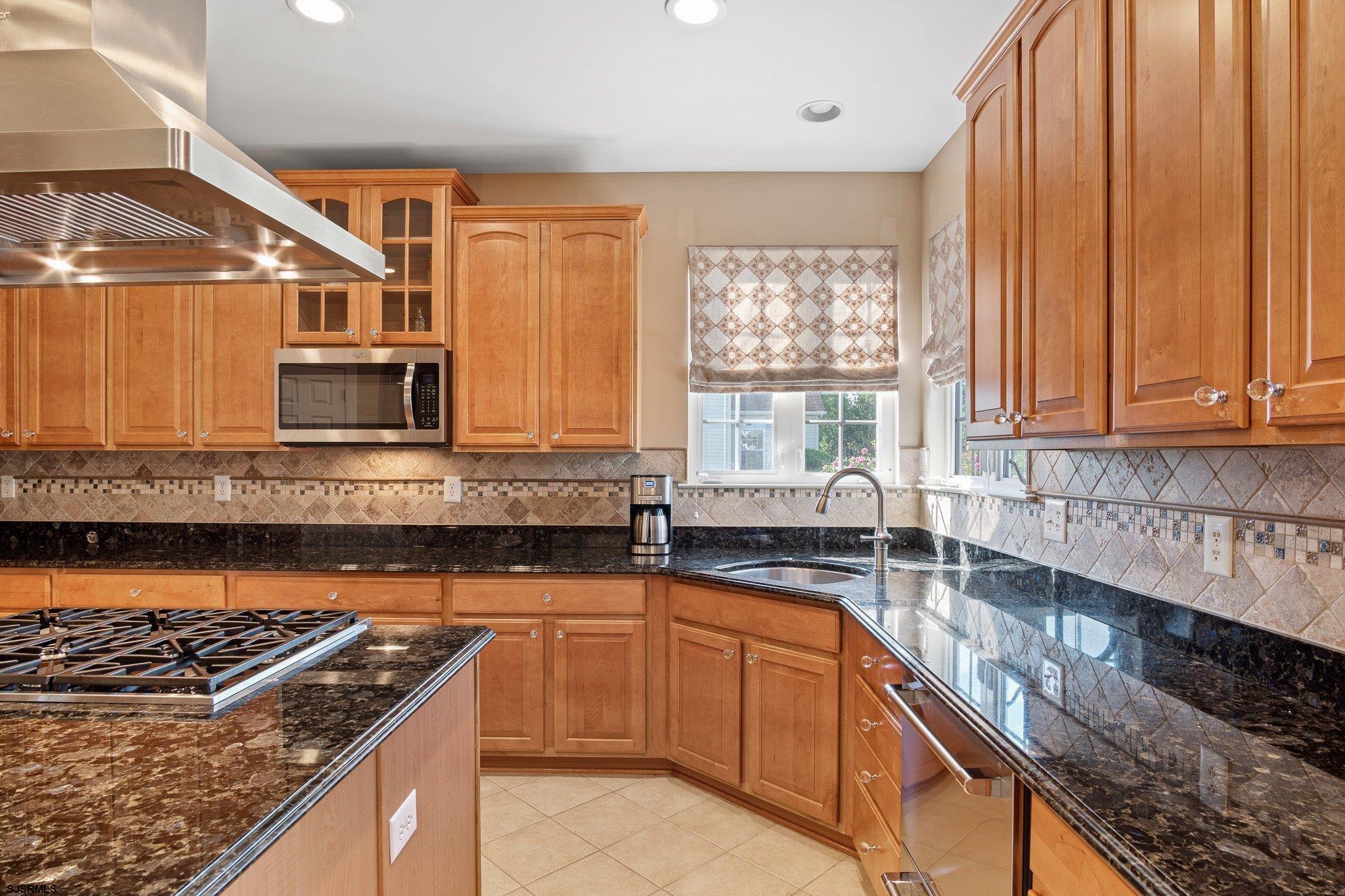 109 Quail Ridge Way Mickleton, NJ 08056 - Photo 41 of 59 a kitchen with stainless steel appliances granite countertop a sink stove and cabinets