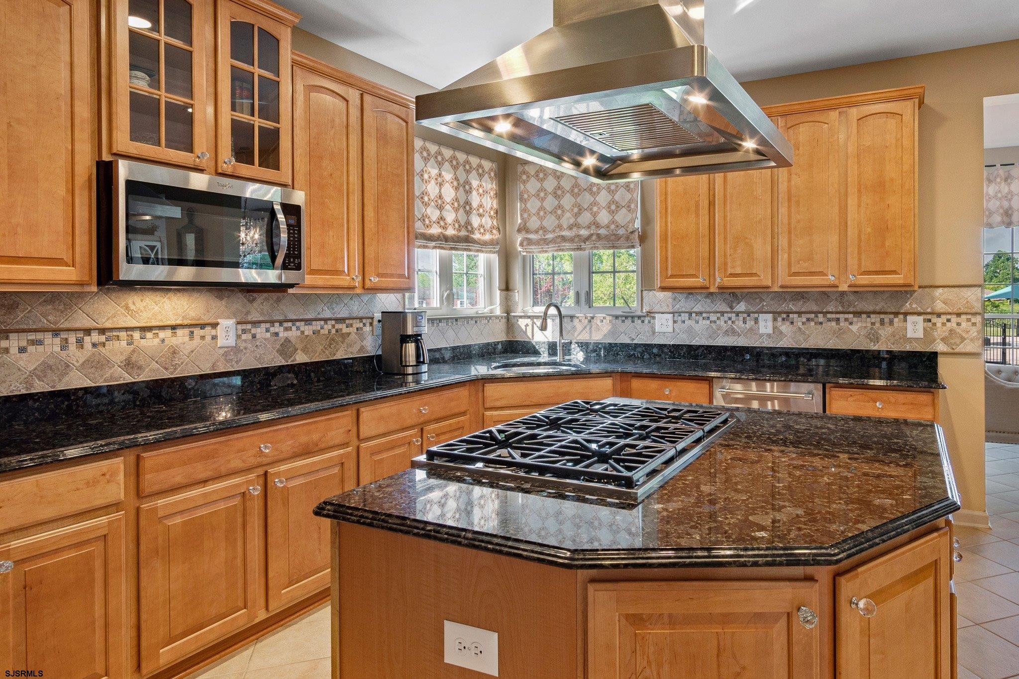 109 Quail Ridge Way Mickleton, NJ 08056 - Photo 42 of 59 a kitchen with stainless steel appliances granite countertop a stove sink and cabinets