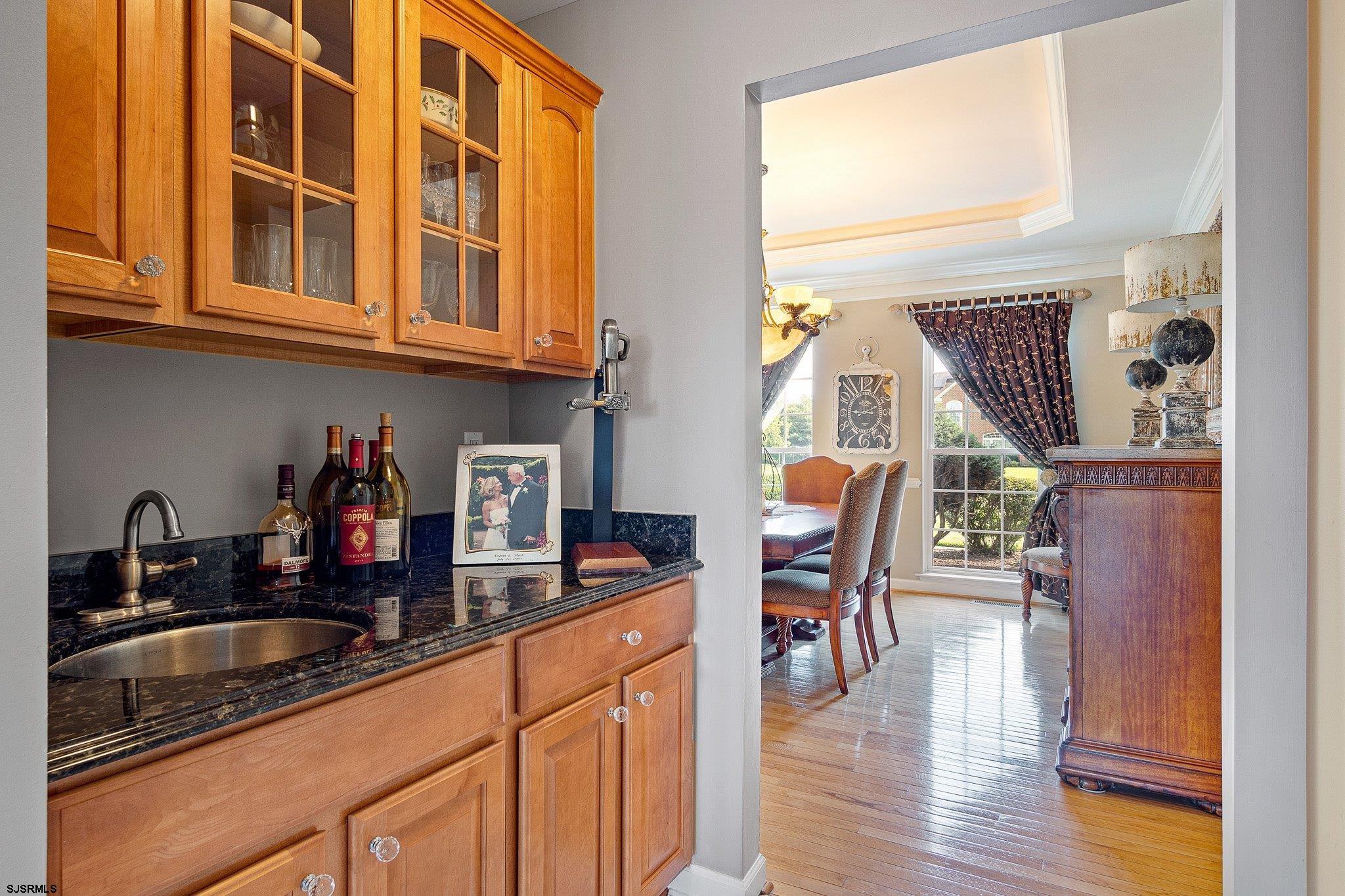 109 Quail Ridge Way Mickleton, NJ 08056 - Photo 44 of 59 a kitchen with stainless steel appliances granite countertop a sink dishwasher and cabinets with wooden floor