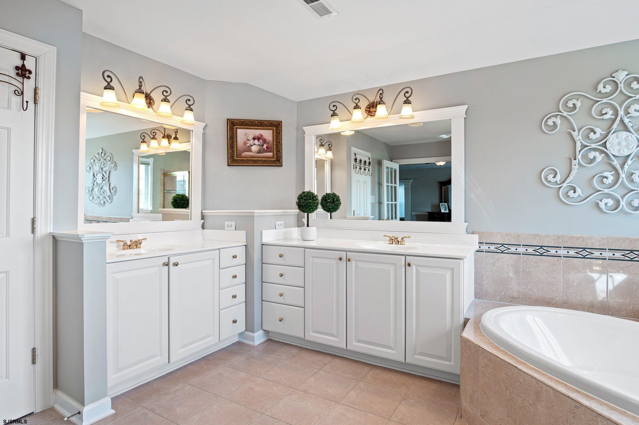 109 Quail Ridge Way Mickleton, NJ 08056 - Photo 54 of 59 a spacious bathroom with a double vanity sink mirror and bathtub