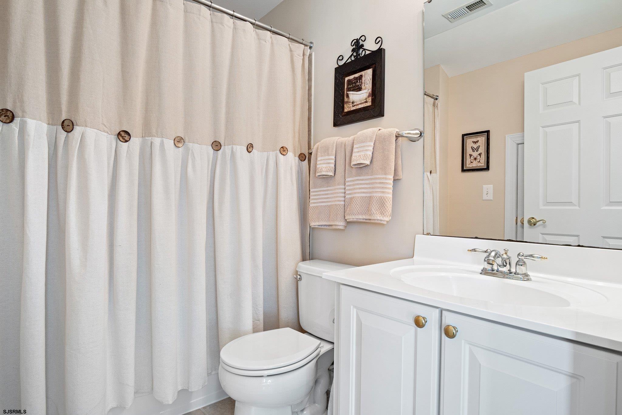 109 Quail Ridge Way Mickleton, NJ 08056 - Photo 56 of 59 a bathroom with a sink a toilet and a mirror