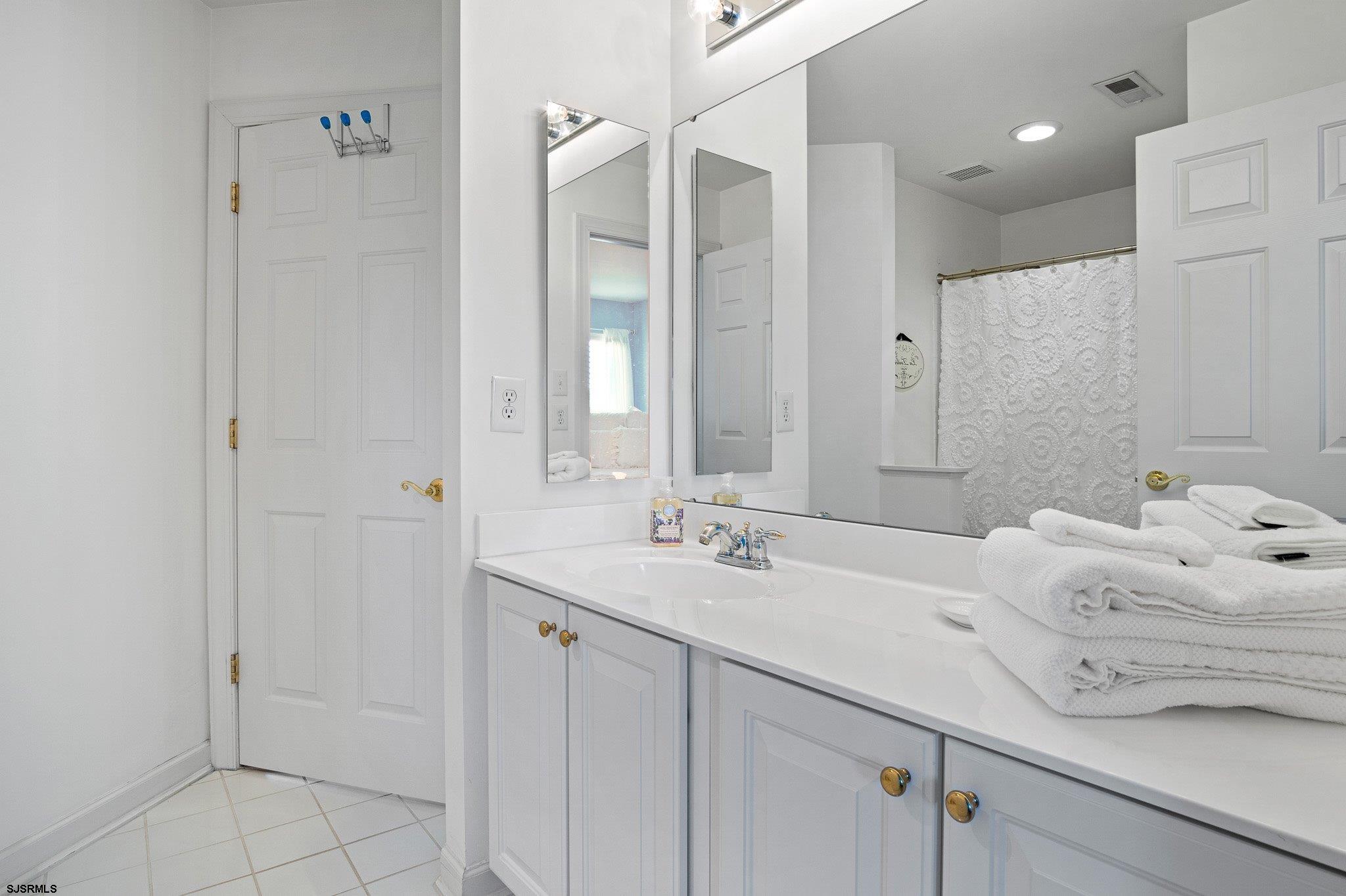 109 Quail Ridge Way Mickleton, NJ 08056 - Photo 57 of 59 a bathroom with a sink and a mirror