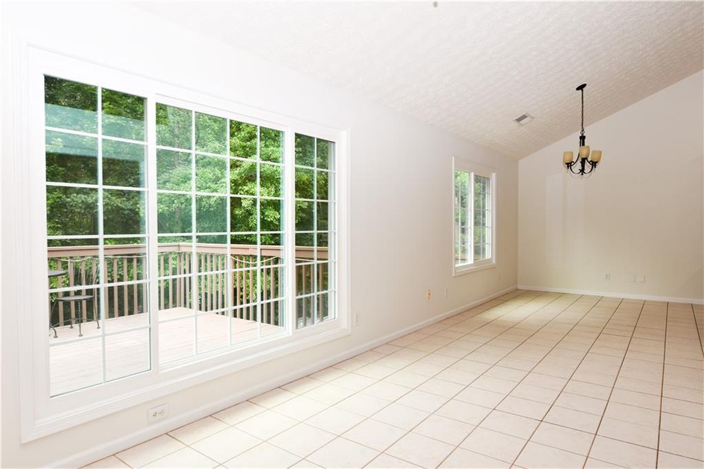 795 Sunset Ridge Lane Southeast Lawrenceville, GA 30045 - Photo 14 of 47 a view of an empty room with a window