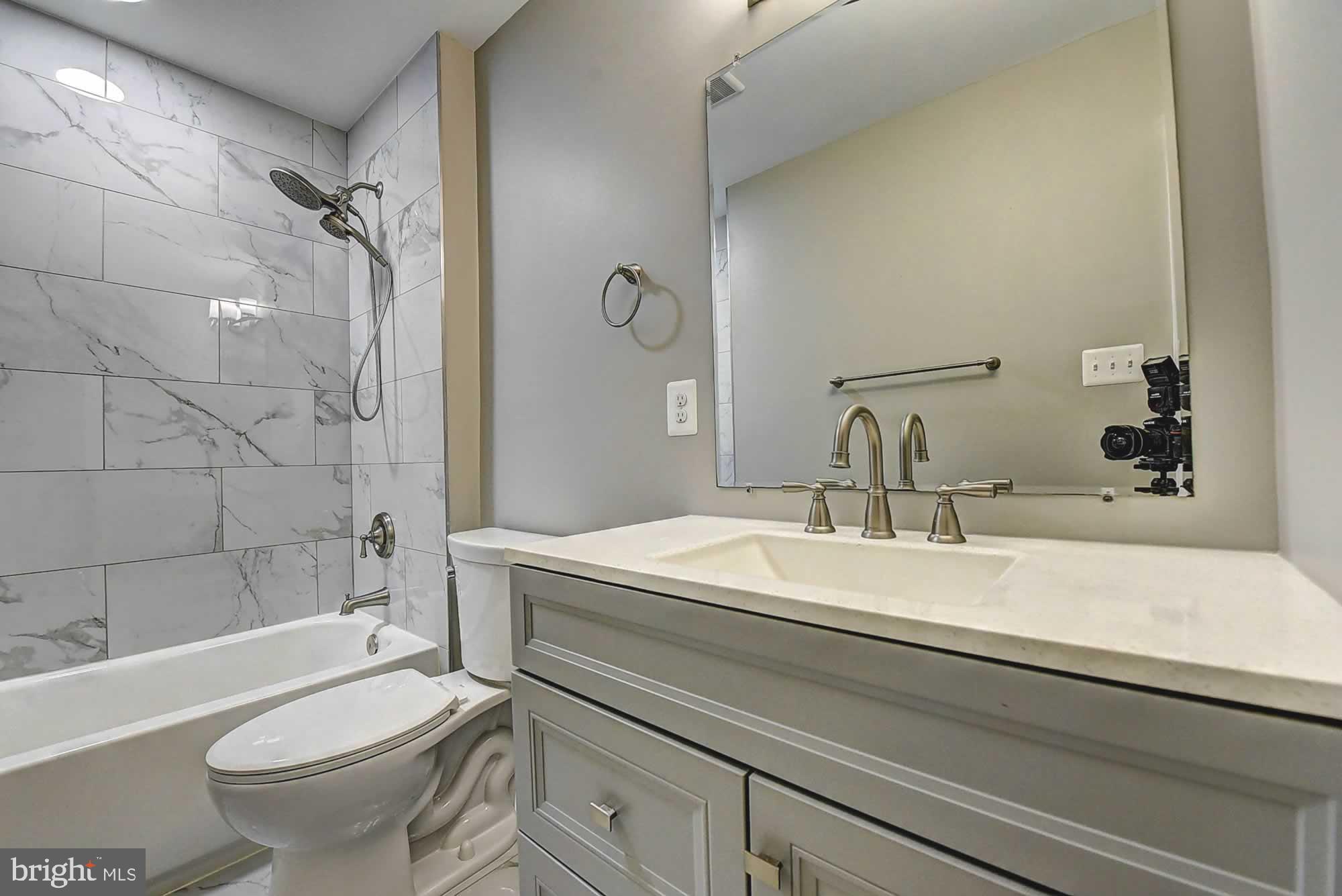 2226 Gunsmith Square Reston, VA 20191 - Photo 25 of 35 a bathroom with a sink a toilet and shower