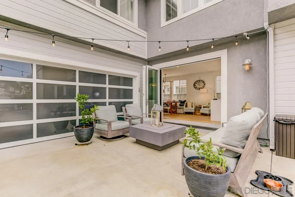 124 Breakwater Road Carlsbad, CA 92011 - Photo 14 of 20 a living room with furniture and a potted plant