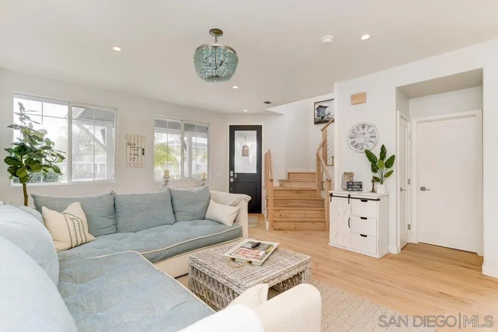 124 Breakwater Road Carlsbad, CA 92011 - Photo 3 of 20 a living room with furniture and flowers