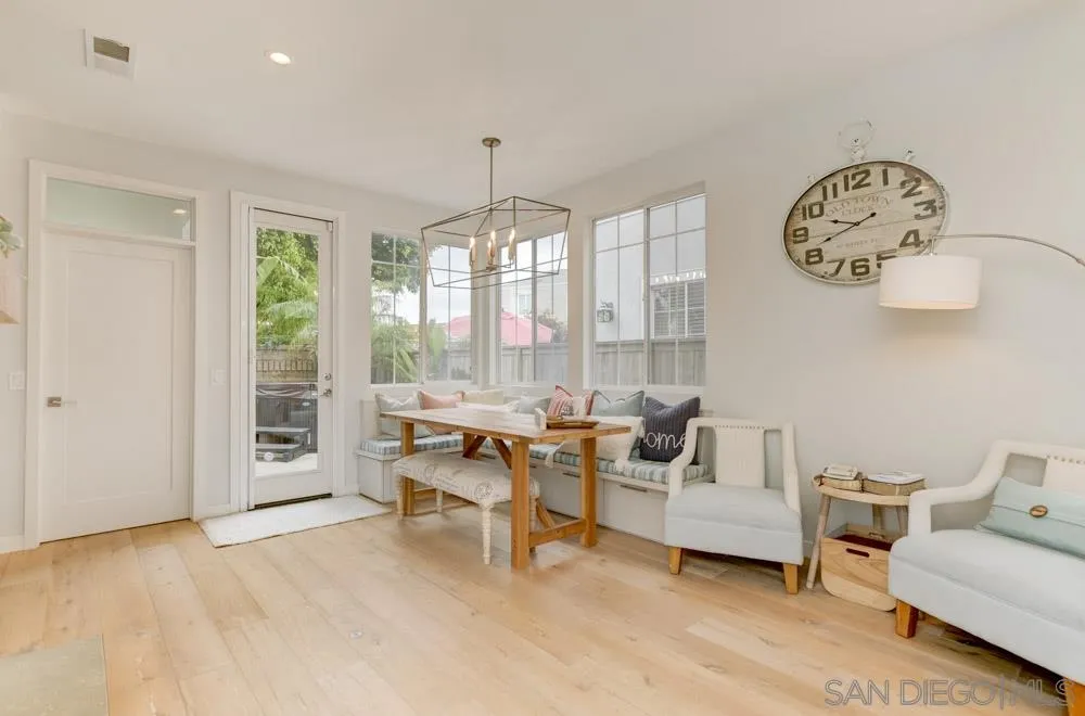 124 Breakwater Road Carlsbad, CA 92011 - Photo 5 of 20 a living room with furniture a table and a large window