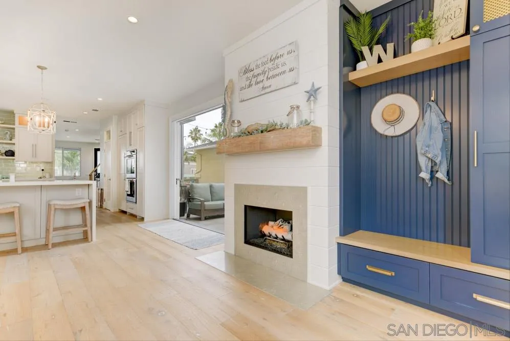 124 Breakwater Road Carlsbad, CA 92011 - Photo 6 of 20 a living room with furniture and a fireplace
