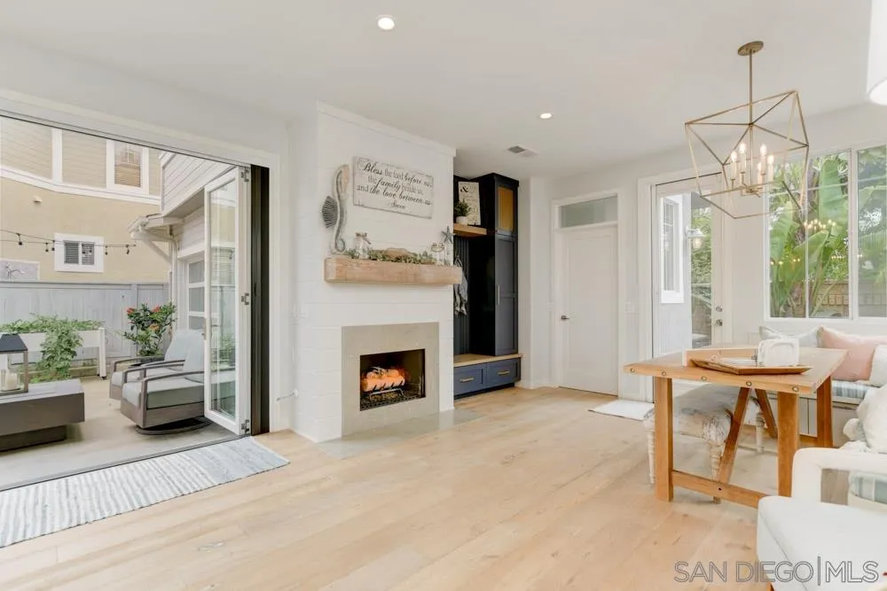 124 Breakwater Road Carlsbad, CA 92011 - Photo 7 of 20 a living room with furniture and a fireplace