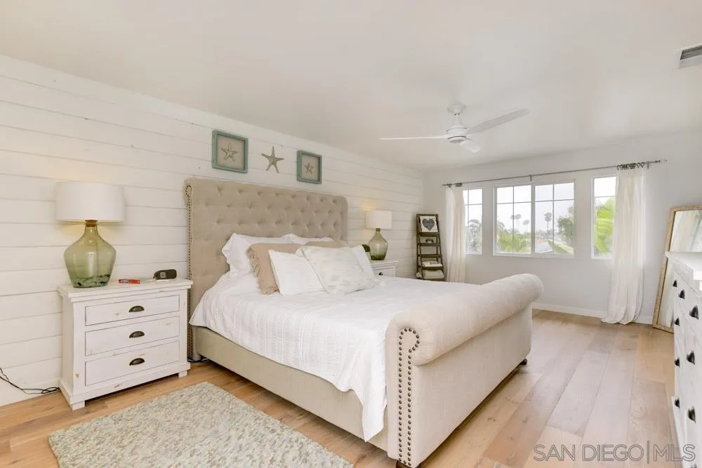 124 Breakwater Road Carlsbad, CA 92011 - Photo 9 of 20 a bedroom with a bed and a dresser